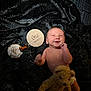 Ryder is registered to the contest to win money with this photo: baby, infant, smile, teddy_bear, cupcake, candle, black_fabric, spiderweb_pattern, diaper, newborn, one_month, happy, lying_down, cute, celebration, soft_toy, child, portrait, indoors, cozy