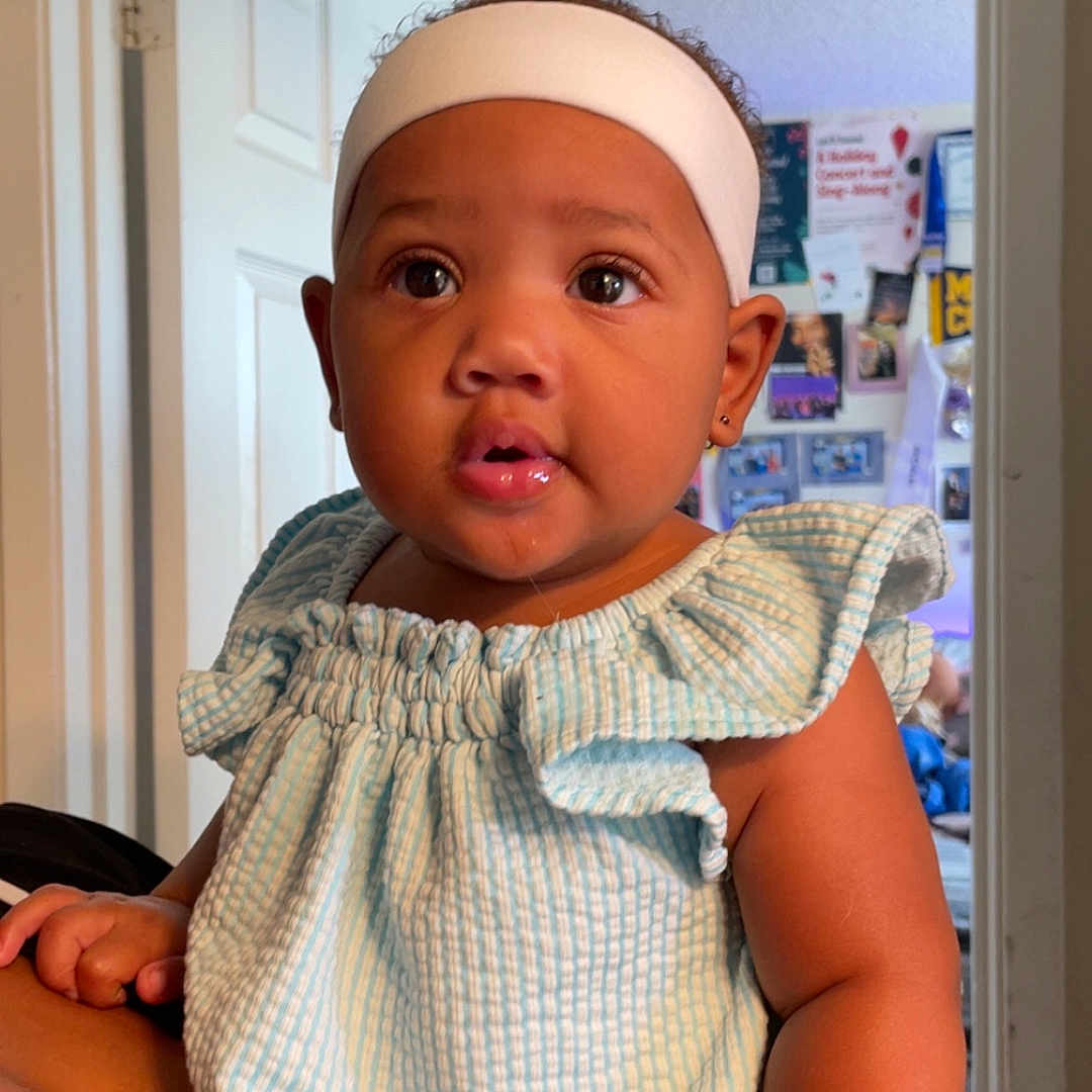 Je Nai is registered to the contest to win money with this photo: arm, baby, blue_striped_top, child, curious, door, drool, earring, expression, eyes, face, hand, headband, holding, indoor, person, photography, portrait, skin, wall