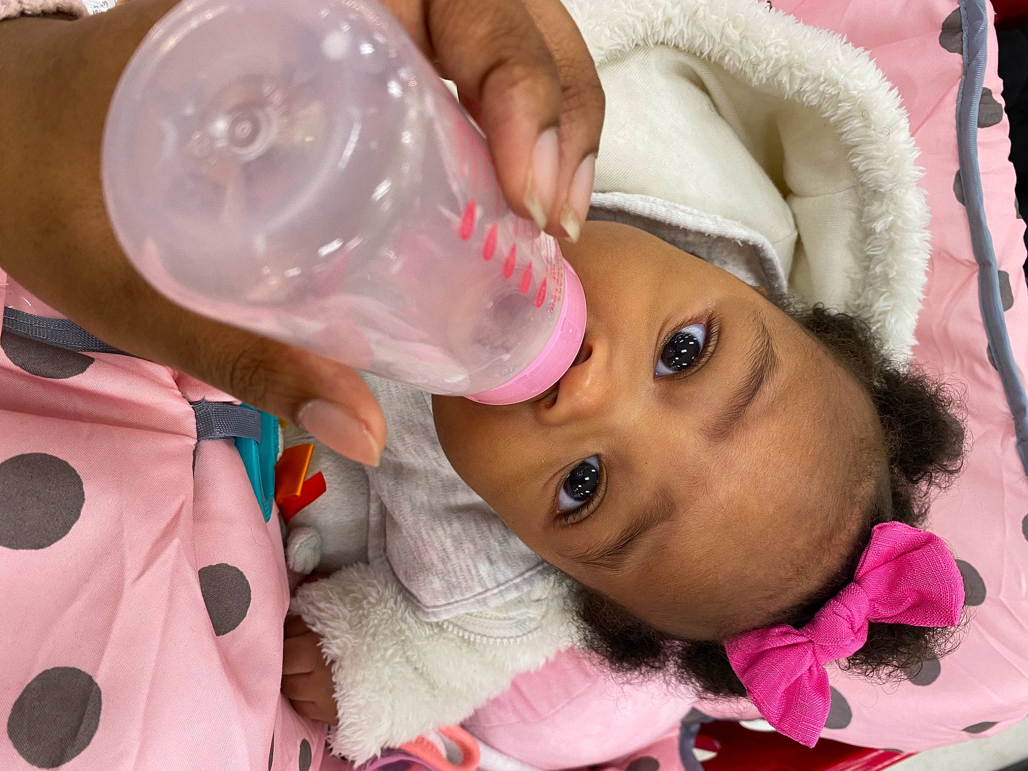 Alayna joined the competition — help win amazing prizes! baby, baby_bottle, bottle, cheek, child, drinkware, ear, eyelash, facial_expression, fluid, liquid, mouth, nose, person, pink, plastic_bottle, skin, tableware, toddler, water_bottle