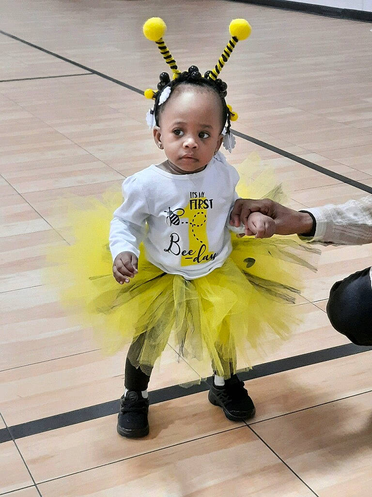 Ja'Zariah joined the competition — help win amazing prizes! baby, baby_toddler_clothing, child, costume, entertainment, event, fashion_accessory, flooring, footwear, fun, fur, happy, mascot, performing_arts, person, shoe, sports, sportswear, t_shirt, team_sport
