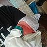 Amiyah is registered to the contest to win money with this photo: newborn, baby, pacifier, blanket, hat, sleeping, tattoo, hospital, person, infant, clothing, bedroom, human, resting, cute, closeup, child, holding, indoor, peaceful