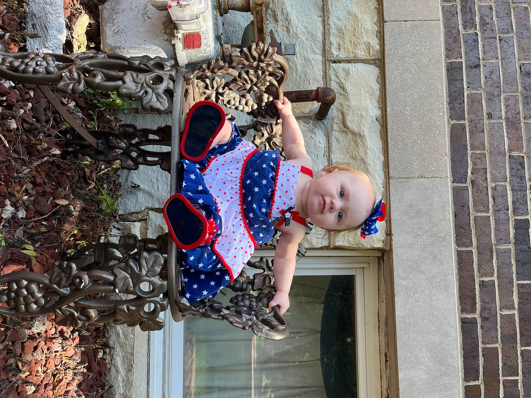 Briella is registered to the contest to win money with this photo: baby_toddler_clothing, brick, brickwork, child, electric_blue, facade, fun, happy, leisure, pattern, person, plant, red, street, t_shirt, toddler, town, tree, wall, water