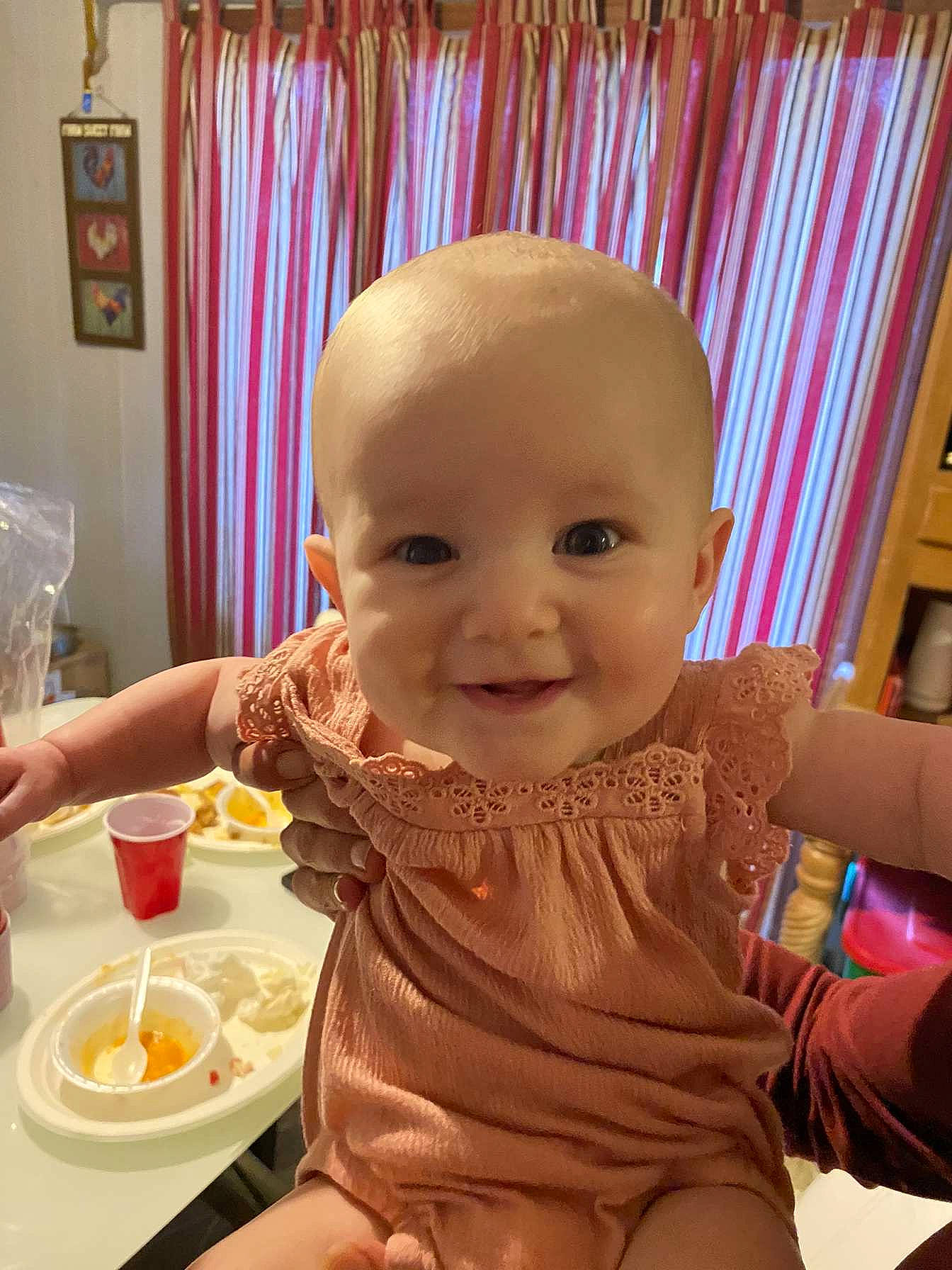 Everlee joined the competition — help win amazing prizes! baby, baby_toddler_clothing, chair, cheek, child, curtain, dishware, eye, food, food_craving, happy, joy, person, pink, plate, sitting, skin, smile, table, tableware