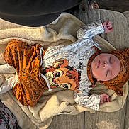 Abdiel Purntes Perez joined the competition — help win amazing prizes! baby, sleeping, infant, blanket, couch, clothing, hat, lion_king, orange, white, soft, cozy, indoors, cute, peaceful, child, portrait, rest, comfort, toddler