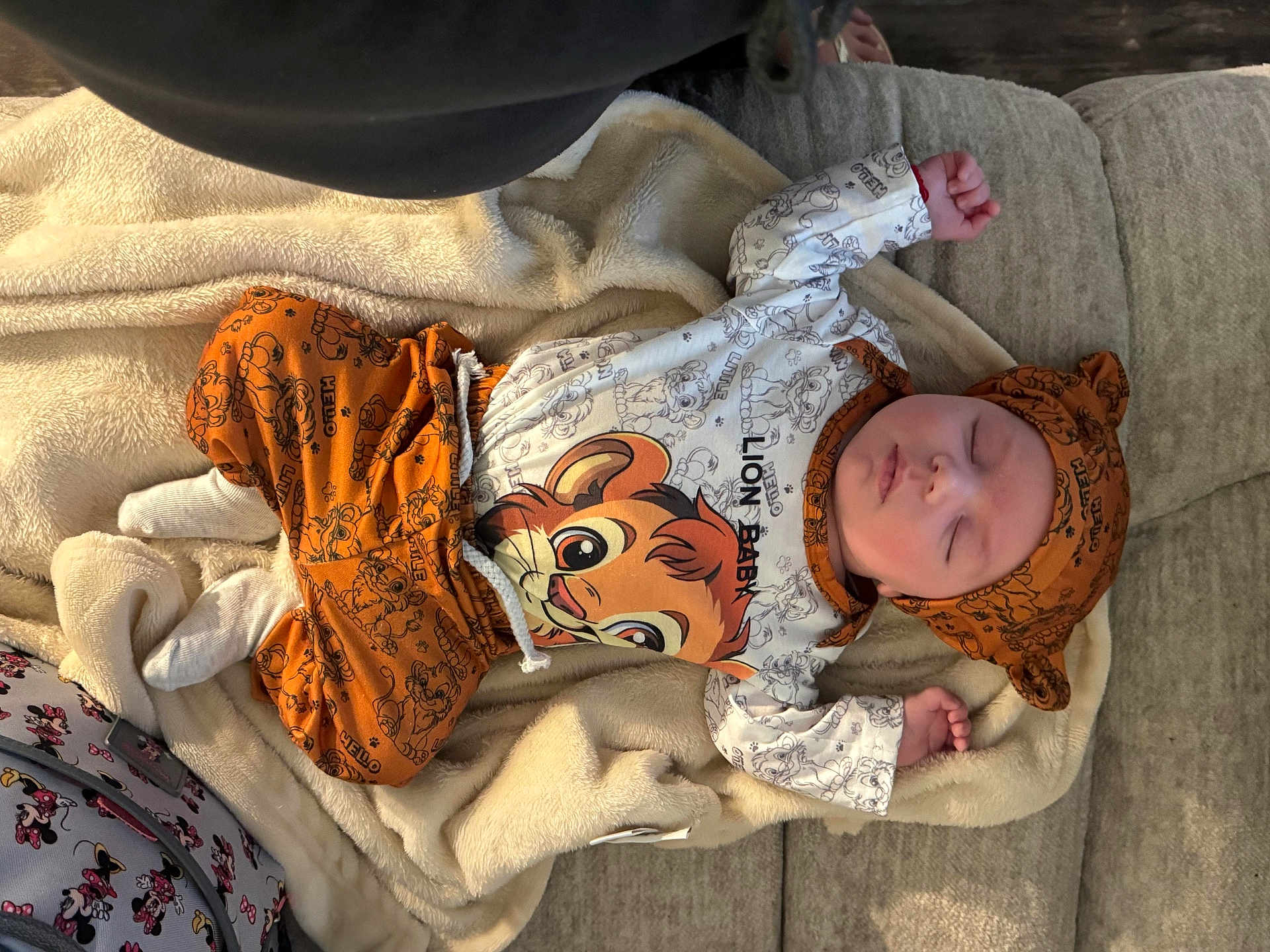 Abdiel Purntes Perez joined the competition — help win amazing prizes! baby, sleeping, infant, blanket, couch, clothing, hat, lion_king, orange, white, soft, cozy, indoors, cute, peaceful, child, portrait, rest, comfort, toddler