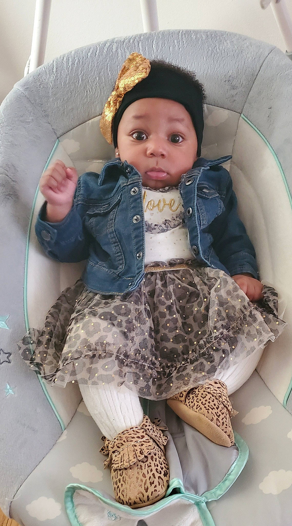 Stori joined the competition — help win amazing prizes! baby, baby_toddler_clothing, cap, chair, child, comfort, fashion_design, hat, head, headwear, jacket, leg, outerwear, pattern, person, skin, sleeve, sun_hat, textile, thigh