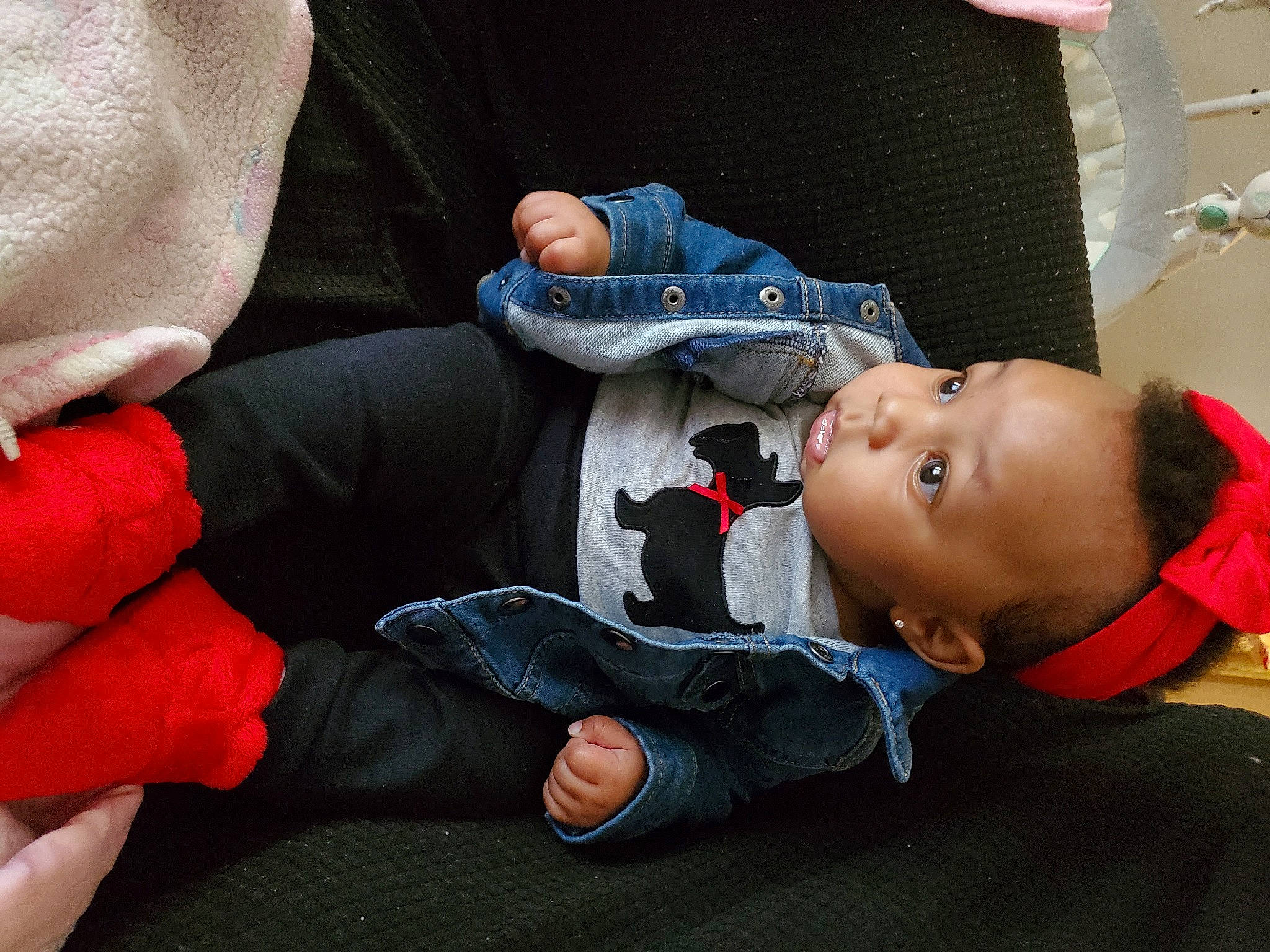 Stori is registered to the contest to win money with this photo: baby, baby_carriage, baby_products, baby_sleeping, baby_toddler_clothing, cheek, comfort, electric_blue, finger, gesture, hand, human_body, joint, lap, leg, mouth, person, sitting, textile, thumb