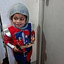 Hector a rejoint le concours — aidez-le/la à gagner de superbes lots ! armor, blue, boots, child, clothing, costume, door, floor, happy, helmet, imagination, indoor, knight, person, play, red, smile, sword, toy, young