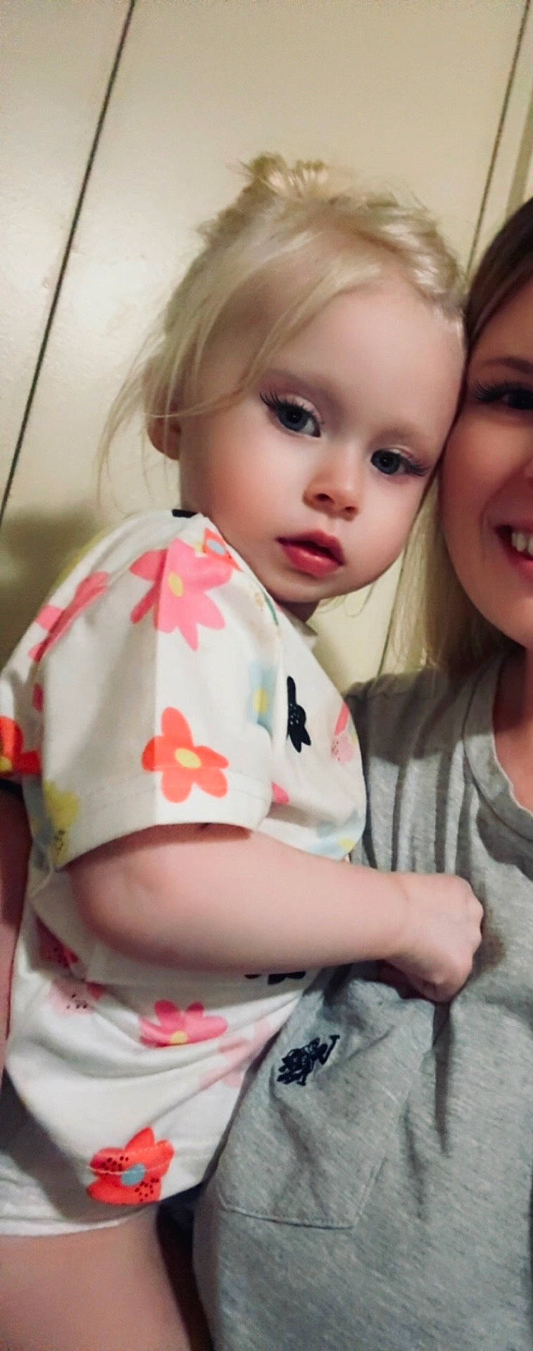 Knoxleigh Kelly Jean is registered to the contest to win money with this photo: adult, blonde_hair, blue_eyes, casual_clothing, child, close_up, cute, face, family, floral_shirt, hair, head, holding, indoor, person, portrait, skin, smile, toddler, young