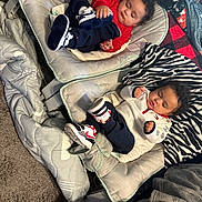 Sincere is registered to the contest to win money with this photo: awake, baby, baby_seat, blanket, carpet, child, clothing, comfort, cozy, curly_hair, cute, footwear, indoor, infant, person, relaxing, resting, sleeping, soft, toddler