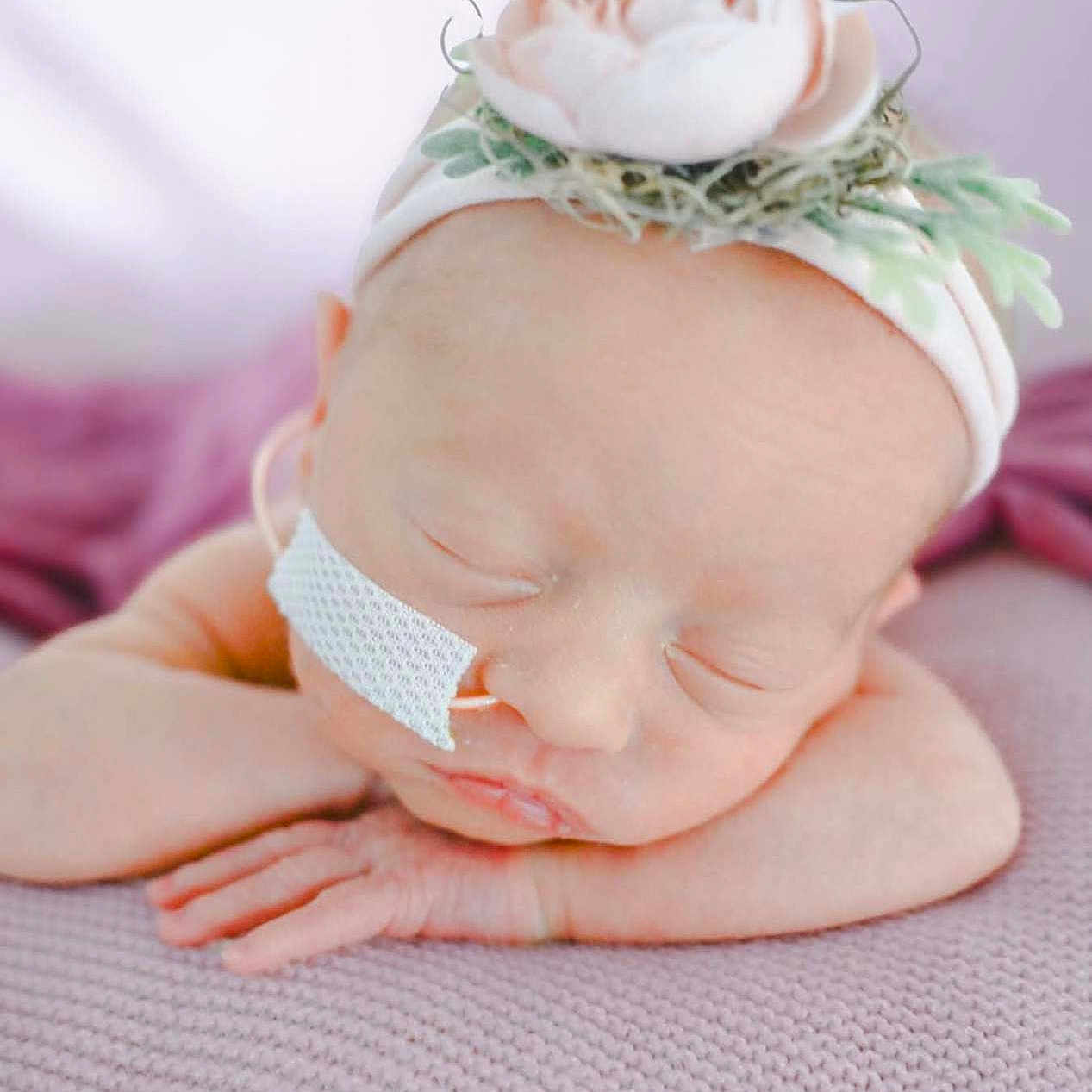 Kylie joined the competition — help win amazing prizes! baby, blanket, child, closeup, cute, delicate, face, flower, hand, headband, infant, medical_tape, newborn, peaceful, portrait, resting, skin, sleeping, soft, tender