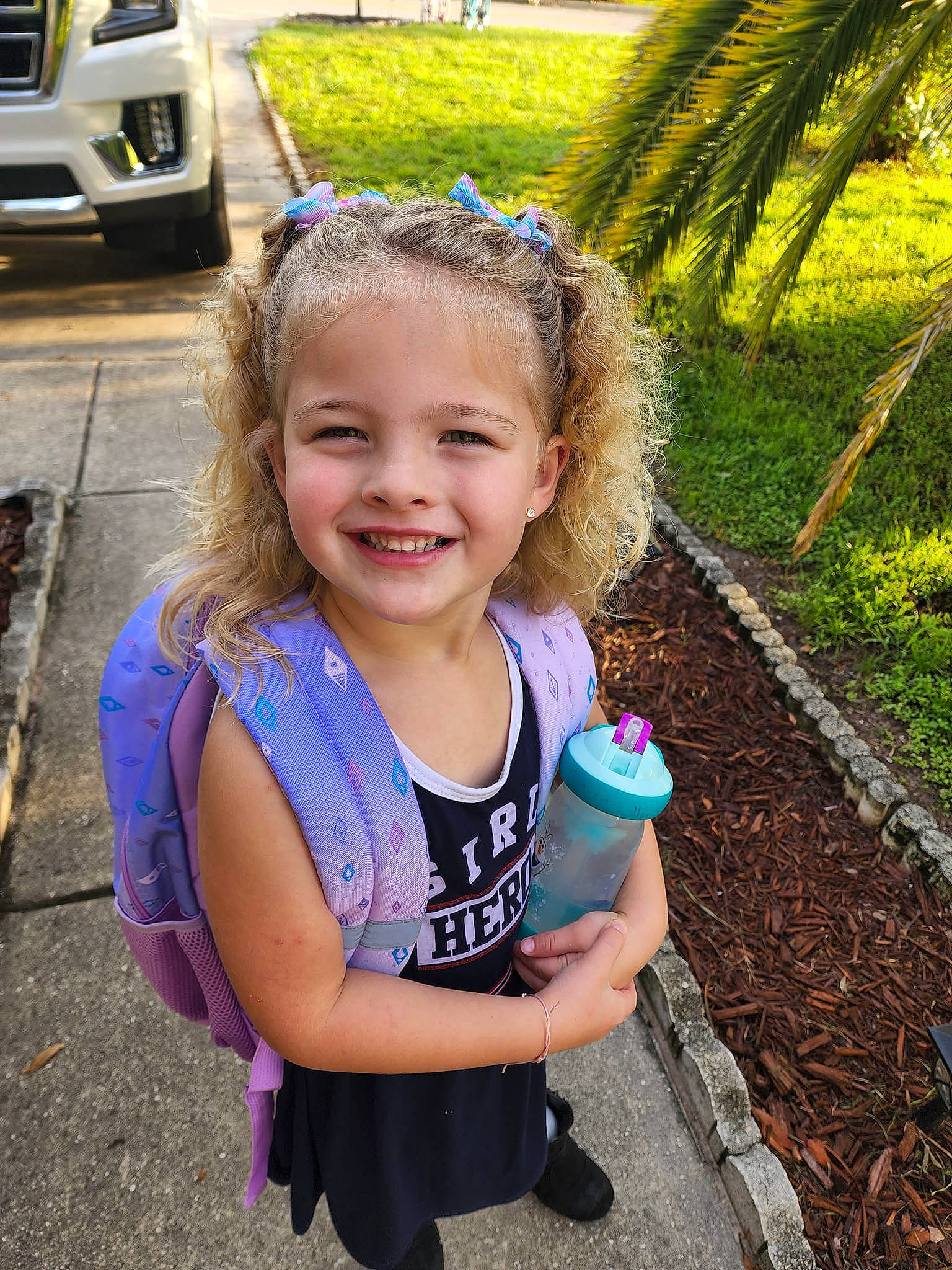 Audriella joined the competition — help win amazing prizes! asphalt, automotive_design, automotive_tire, child, electric_blue, fun, grass, hairstyle, happy, joy, leisure, mammal, person, plant, recreation, smile, soil, summer, tire, toddler