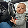 éthan participe au concours pour gagner de l'argent avec cette photo : baby, blue_eyes, car, child, closeup, cloudy_sky, cute, dashboard, gray_outfit, hand, interior, jeans, lap, person, portrait, seat, serious, steering_wheel, vehicle, window