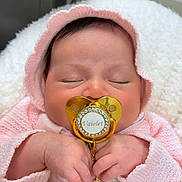 Vaiolet joined the competition — help win amazing prizes! baby, sleeping, pacifier, pink_hoodie, blanket, hands, face, infant, cozy, soft_texture, cute, newborn, peaceful, resting, knitwear, child, adorable, indoor, portrait, young_child