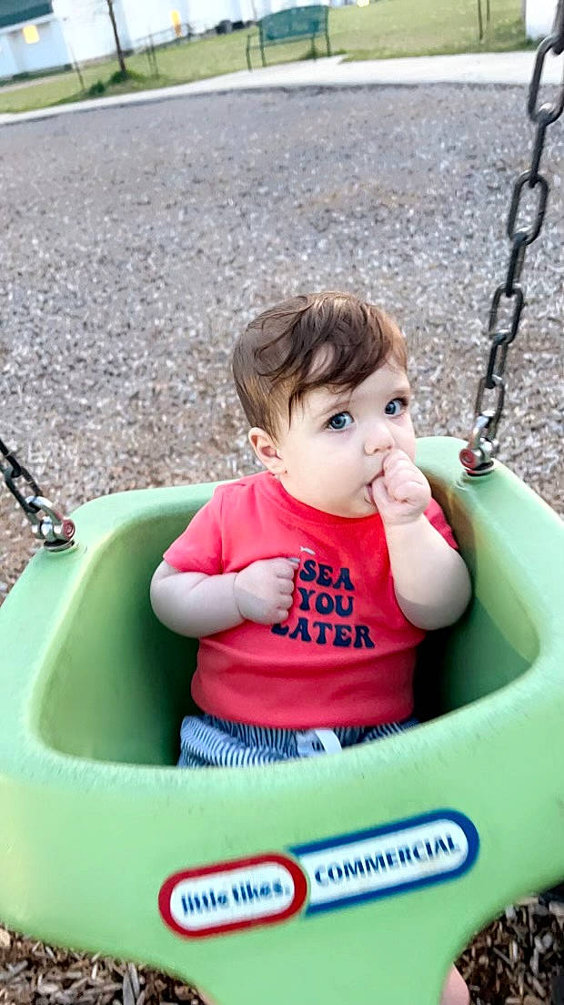 Daxton is registered to the contest to win money with this photo: baby, baby_toddler_clothing, child, fun, grass, green, hand, happy, leisure, person, photograph, plant, playground, product, recreation, skin, summer, tire, toddler, white