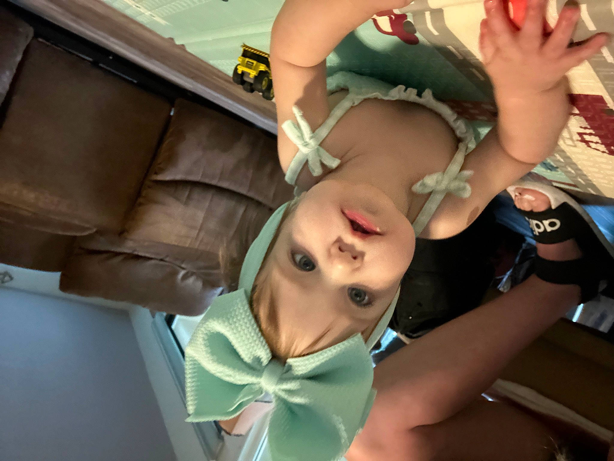 Delilah is registered to the contest to win money with this photo: abdomen, automotive_design, black_hair, chest, child, eyelash, eyewear, fun, gesture, happy, leisure, mouth, person, shipping_box, sunglasses, tattoo, thigh, toddler, tree, trunk