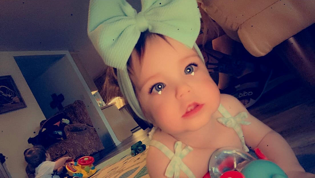 Delilah is registered to the contest to win money with this photo: baby, cheek, child, ear, eyebrow, eyelash, facial_expression, fun, happy, iris, lip, mouth, nose, people, photograph, pink, skin, snapshot, toddler, white