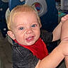 Hudson is registered to the contest to win money with this photo: baby, child, toddler, smiling, happy, portrait, blue_eyes, blond_hair, indoor, playroom, play_structure, toy, red_bib, gray_shirt, white_pants, adult, sitting, climbing, family, photography