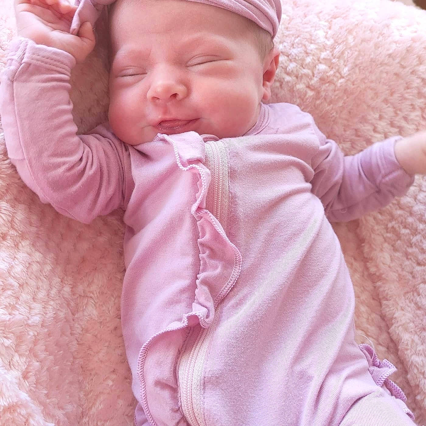 Amelia is registered to the contest to win money with this photo: baby, baby_sleeping, baby_toddler_clothing, cheek, comfort, eye, face, finger, head, lip, mouth, nose, outerwear, person, pink, product, skin, sleeve, textile, toddler