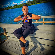 Isis joined the competition — help win amazing prizes! child, girl, smiling, bench, lake, water, outdoor, daylight, sky, clouds, wooden_bench, casual_clothing, black_shoes, bracelets, happy, nature, portrait, posing, sunny, relaxing