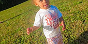 Aelia joined the competition — help win amazing prizes! toddler, child, girl, grass, outdoor, sunny, field, trees, blue_sky, curly_hair, pink_bow, tshirt, pants, floral_pattern, shoes, smiling, standing, nature, daylight, playful