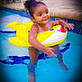 Aluna joined the competition — help win amazing prizes! child, toddler, pool, water, inflatable, yellow, shark, swimming, happy, smiling, hairband, purple, summer, outdoor, play, fun, splash, legs, arms, swimwear