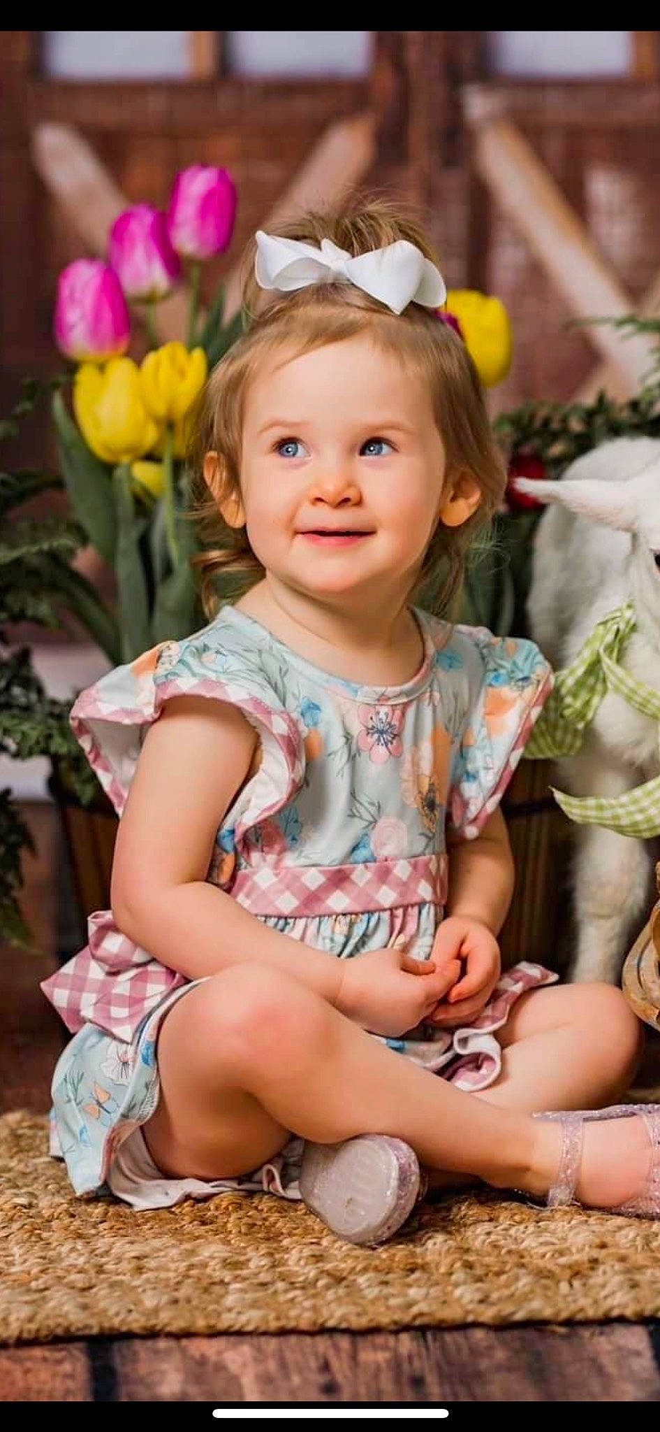 Brynlyn is registered to the contest to win money with this photo: baby, baby_toddler_clothing, eye, face, facial_expression, flower, fun, grass, hairstyle, happy, head, iris, joy, organ, person, photograph, pink, plant, skin, smile