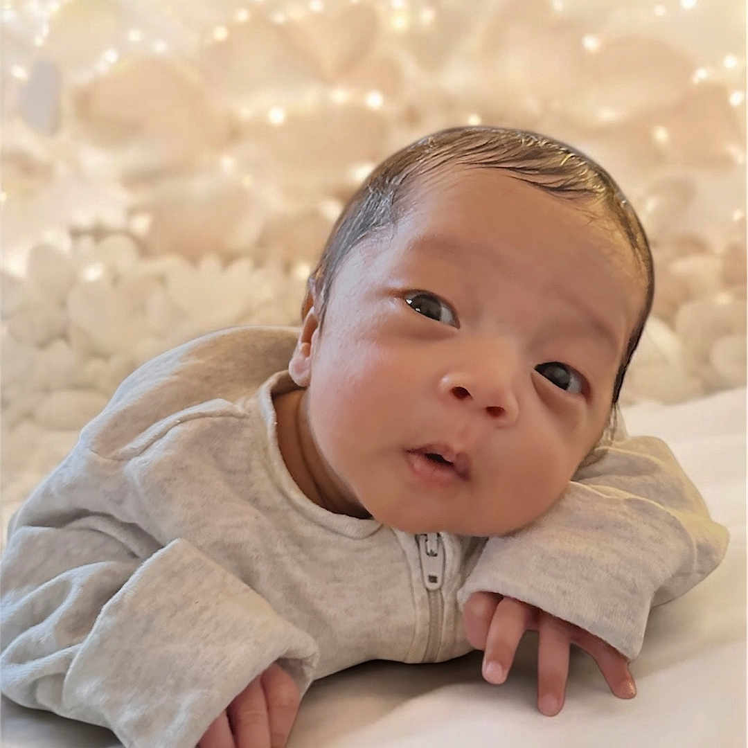 Arden is registered to the contest to win money with this photo: accessories, baby, blanket, blonde, bodypart, clothing, face, finger, hair, hand, happy, head, jewelry, newborn, people, person, photography, portrait, sleeve, smile