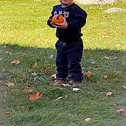 Harley joined the competition — help win amazing prizes! child, toddler, boy, outdoor, autumn, fall, pumpkin, grass, lawn, leaves, portrait, standing, smiling, sweatshirt, pants, shoes, park, garden, rocks, nature