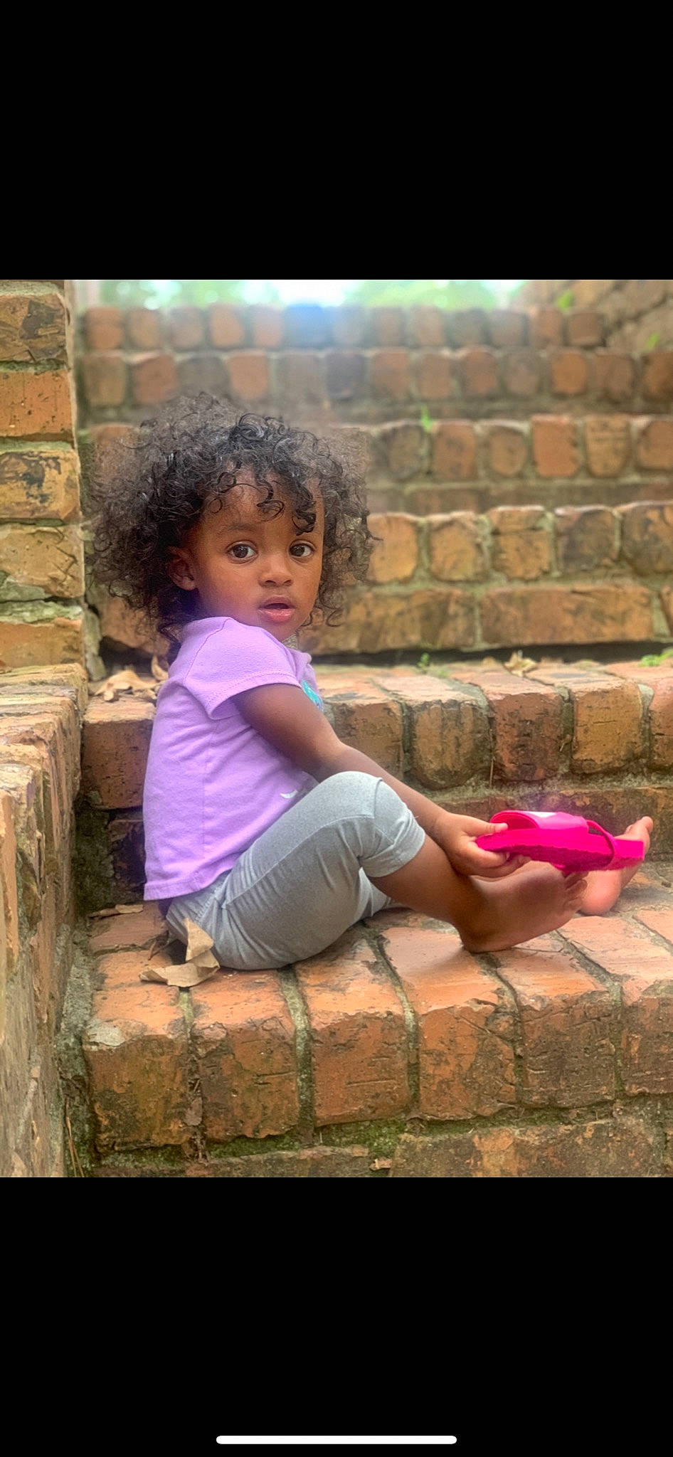 Aviah joined the competition — help win amazing prizes! adaptation, brick, brickwork, child, facial_expression, flash_photography, fun, grass, happy, human_body, human_leg, leisure, magenta, person, photograph, pink, purple, skin, tints_and_shades, wall