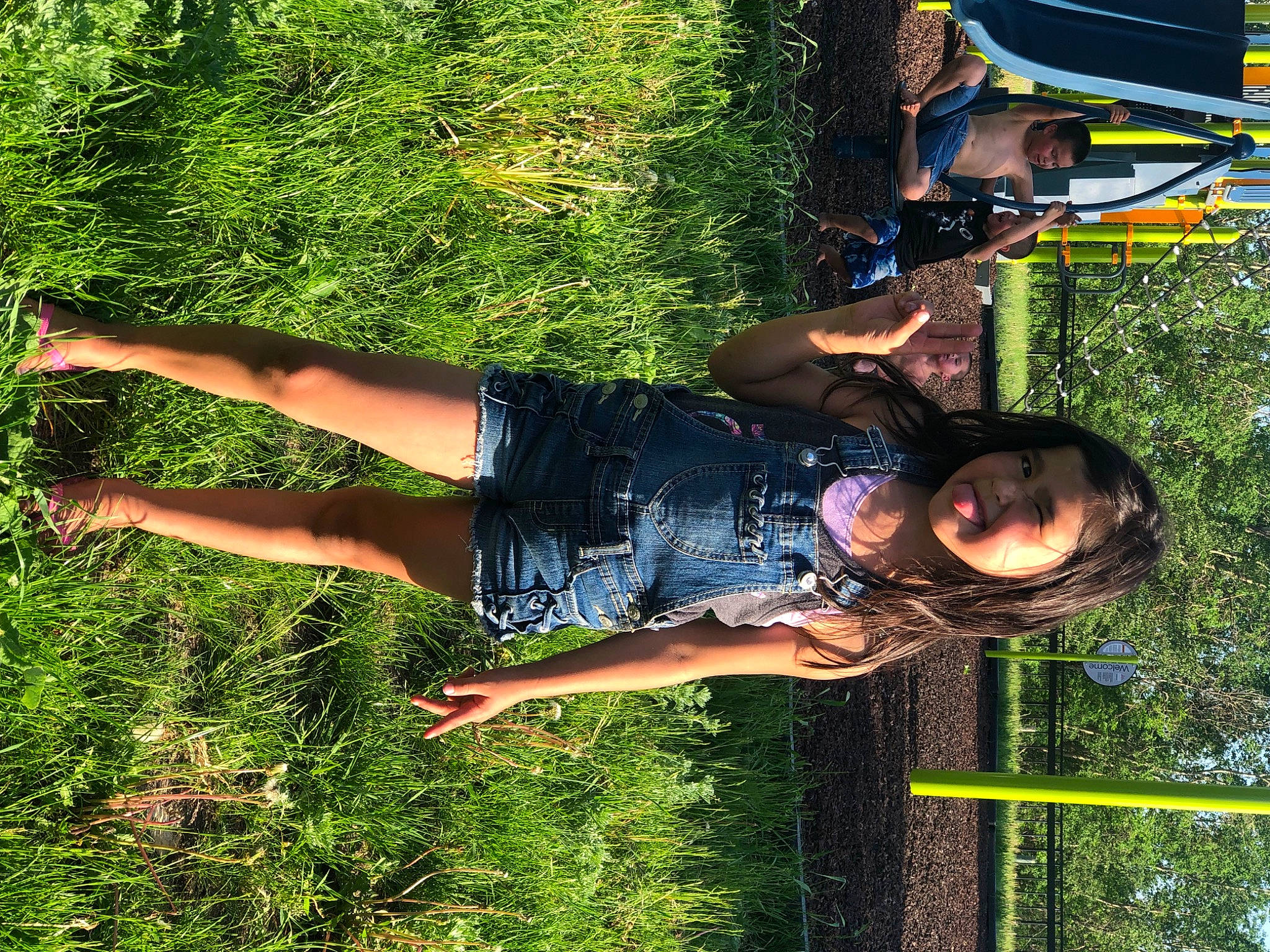 Justice is registered to the contest to win money with this photo: cool, fun, grass, happy, human_leg, leisure, people_in_nature, person, plant, recreation, shorts, smile, thigh, tree