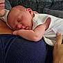 Cataleya joined the competition — help win amazing prizes! newborn, baby, sleeping, infant, person, adult, hand, tattoo, white_clothing, blue_clothing, couch, indoor, closeup, skin, face, arm, comfort, care, rest, peaceful