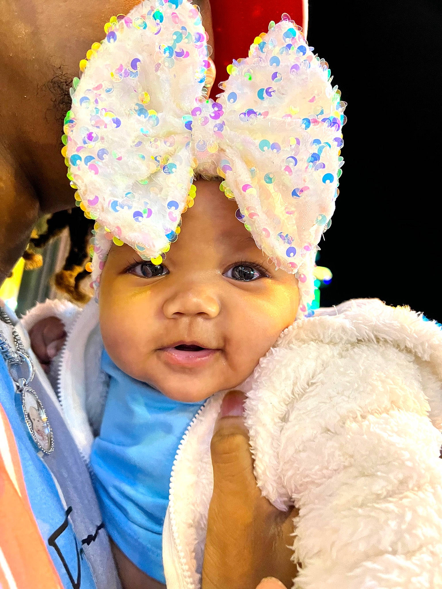 Maeva is registered to the contest to win money with this photo: baby, blue, cap, child, costume_hat, event, facial_expression, fashion, fashion_accessory, fun, hair_accessory, happy, headgear, headpiece, headwear, knit_cap, magenta, party_supply, person, pink