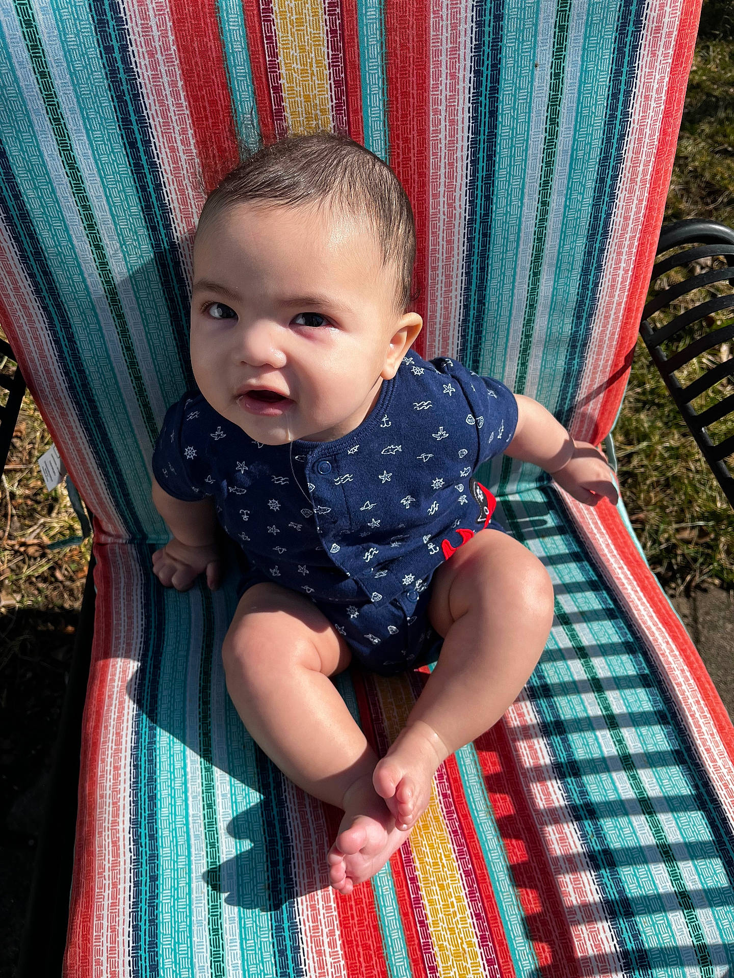 Liam joined the competition — help win amazing prizes! baby, chair, clothing, face, furniture, grass, hammock, head, homedecor, nature, outdoors, person, photography, plant, portrait, quilt, shorts, sitting, summer, yard