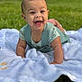 baby, smiling, outdoor, grass, blanket, child, happy, cute, infant, toddler, clothing, person, face, portrait, greenery, nature, lying_down, young_child, playful, sunlight