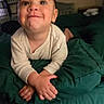 Oliver is registered to the contest to win money with this photo: toddler, child, smiling, indoor, blanket, green, cute, happy, face, person, baby, clothing, bedroom, portrait, young, expression, hands, crawling, cozy, warm