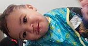 Oliver joined the competition — help win amazing prizes! toddler, child, bib, food, highchair, tray, face, hand, indoor, messy, smiling, clothing, person, cute, baby, feeding, expression, playful, closeup, seat