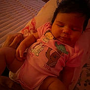 Vivianna joined the competition — help win amazing prizes! baby, sleeping, infant, onesie, pink_clothing, indoor, bed, blanket, cartoon_characters, hair, peaceful, person, child, cute, resting, couch, soft_lighting, television, furniture, holding_hand