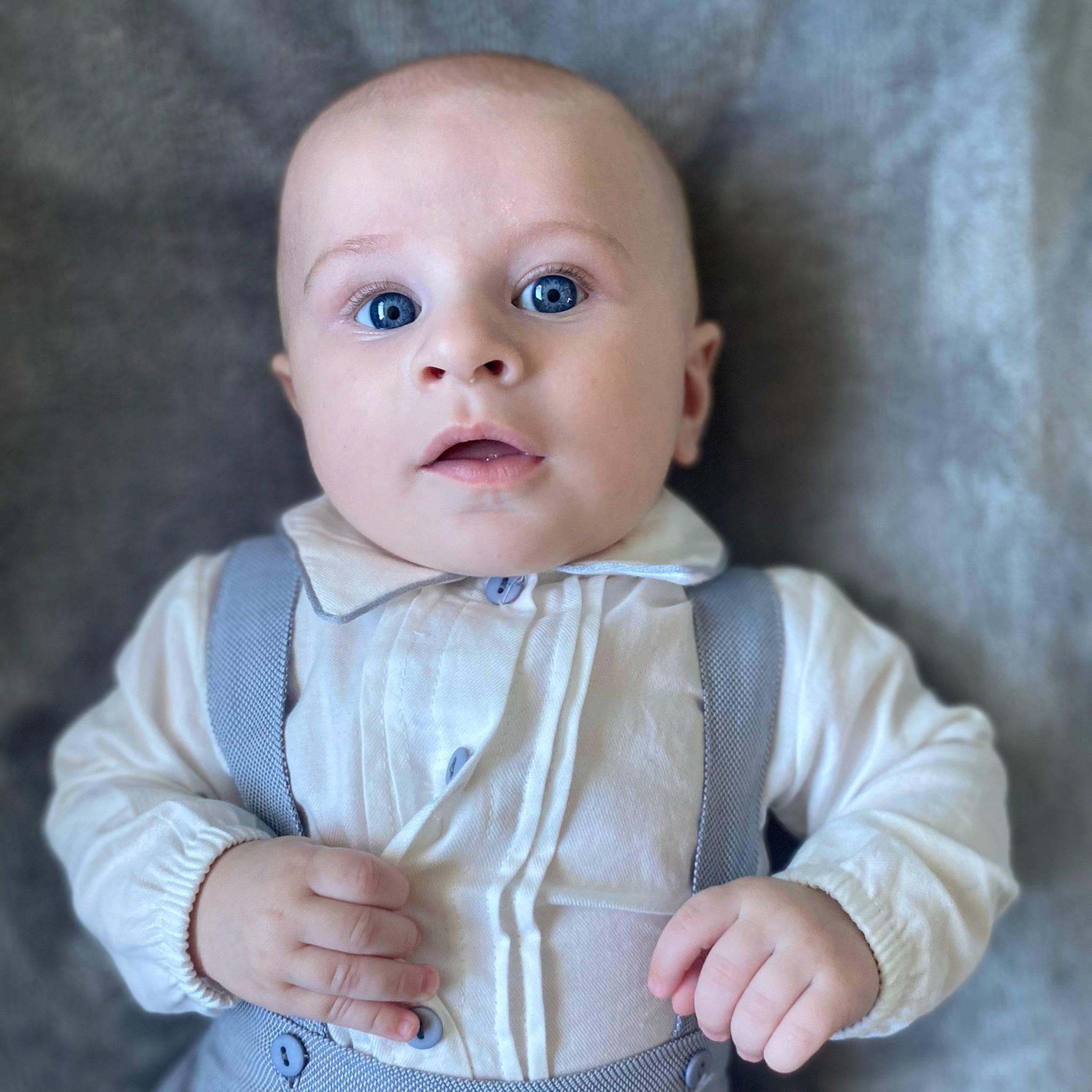 Hudson is registered to the contest to win money with this photo: arm, baby, baby_toddler_clothing, cheek, eye, eyebrow, eyelash, gesture, hand, happy, iris, lip, mouth, nose, organ, outerwear, person, pink, skin, sleeve