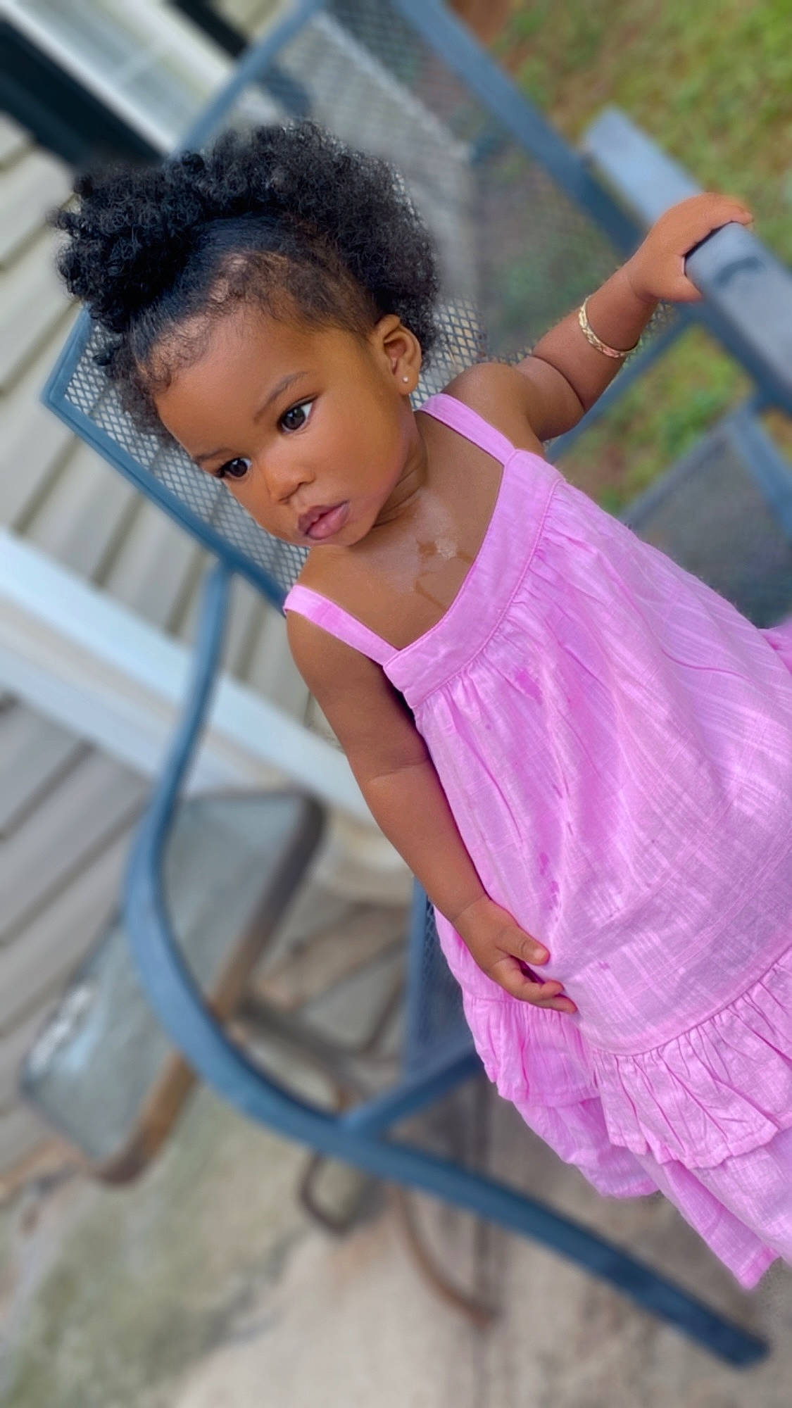 Khaleesi is registered to the contest to win money with this photo: arm, baby, baby_toddler_clothing, cheek, child, eyelash, fun, grass, hair, happy, leisure, lip, magenta, person, play, portrait_photography, recreation, sitting, toddler, vacation