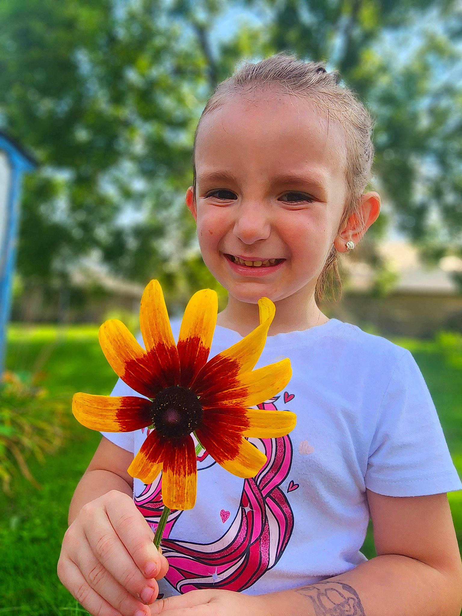 Mila joined the competition — help win amazing prizes! annual_plant, brown_hair, child, daisy_family, dress, electric_blue, flower, flowering_plant, grass, hand, happy, iris, joy, leaf, people_in_nature, person, petal, plant, smile, sunflower