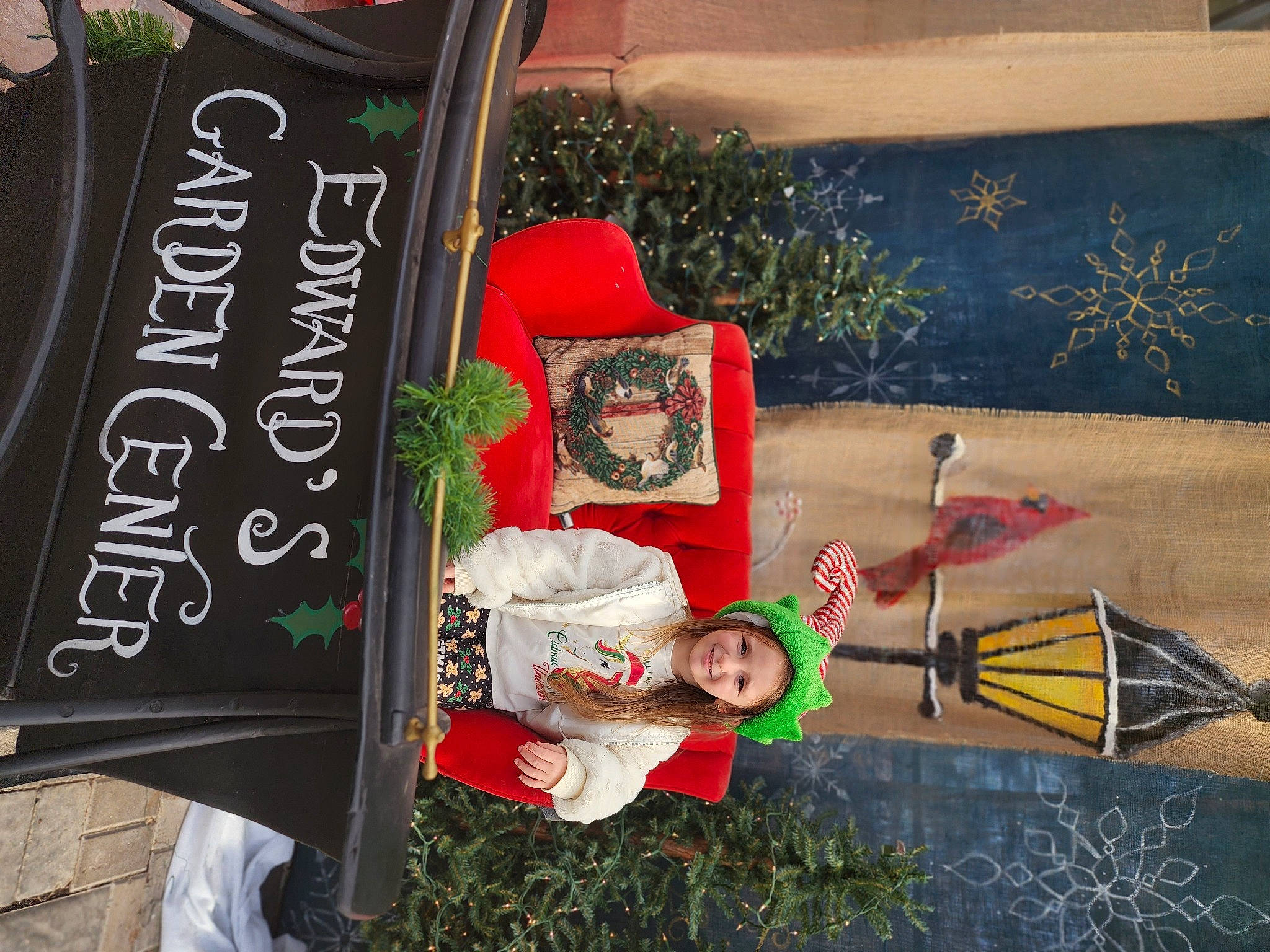 Mila is registered to the contest to win money with this photo: advertising, art, banner, carmine, event, font, happy, hat, headwear, holiday, joy, person, plant, room, smile, visual_arts