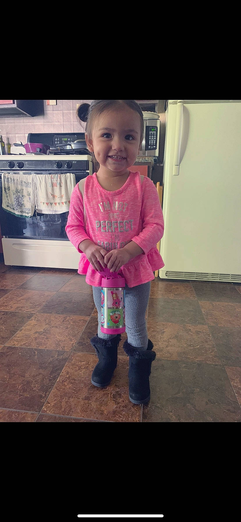 Elyssa is registered to the contest to win money with this photo: child, footwear, joy, outerwear, person, pink, play, shoe, smile, snapshot, standing, toddler