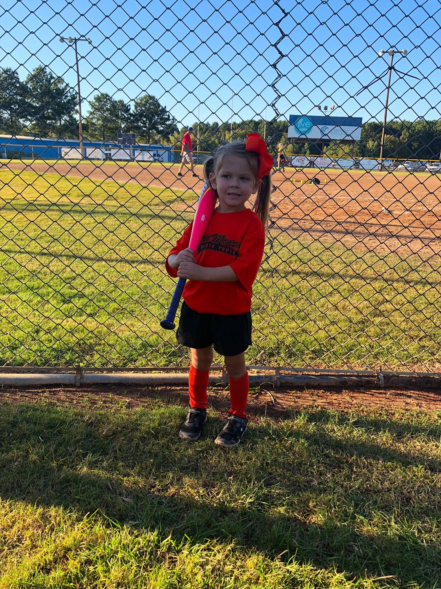 Ana-marie is registered to the contest to win money with this photo: chain_link_fencing, child, fence, fun, grass, net, person, plant, play, player, sky, sport_venue, spring, team_sport, wire_fencing