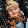 baby, child, cute, expression, eyes, face, fuzzy_clothing, hat, infant, jacket, leopard_print, mickey_mouse, outdoor, person, pom_pom, portrait, seatbelt, stroller, warm, winter_clothing