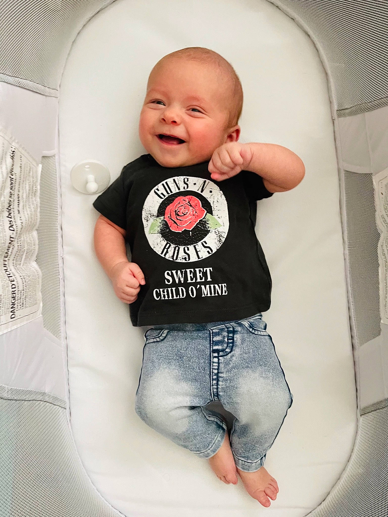 Hudson is registered to the contest to win money with this photo: arm, baby, baby_toddler_clothing, child, comfort, cool, denim, flash_photography, fun, grey, happy, jeans, outerwear, pattern, person, shorts, sitting, sleeve, smile, t_shirt