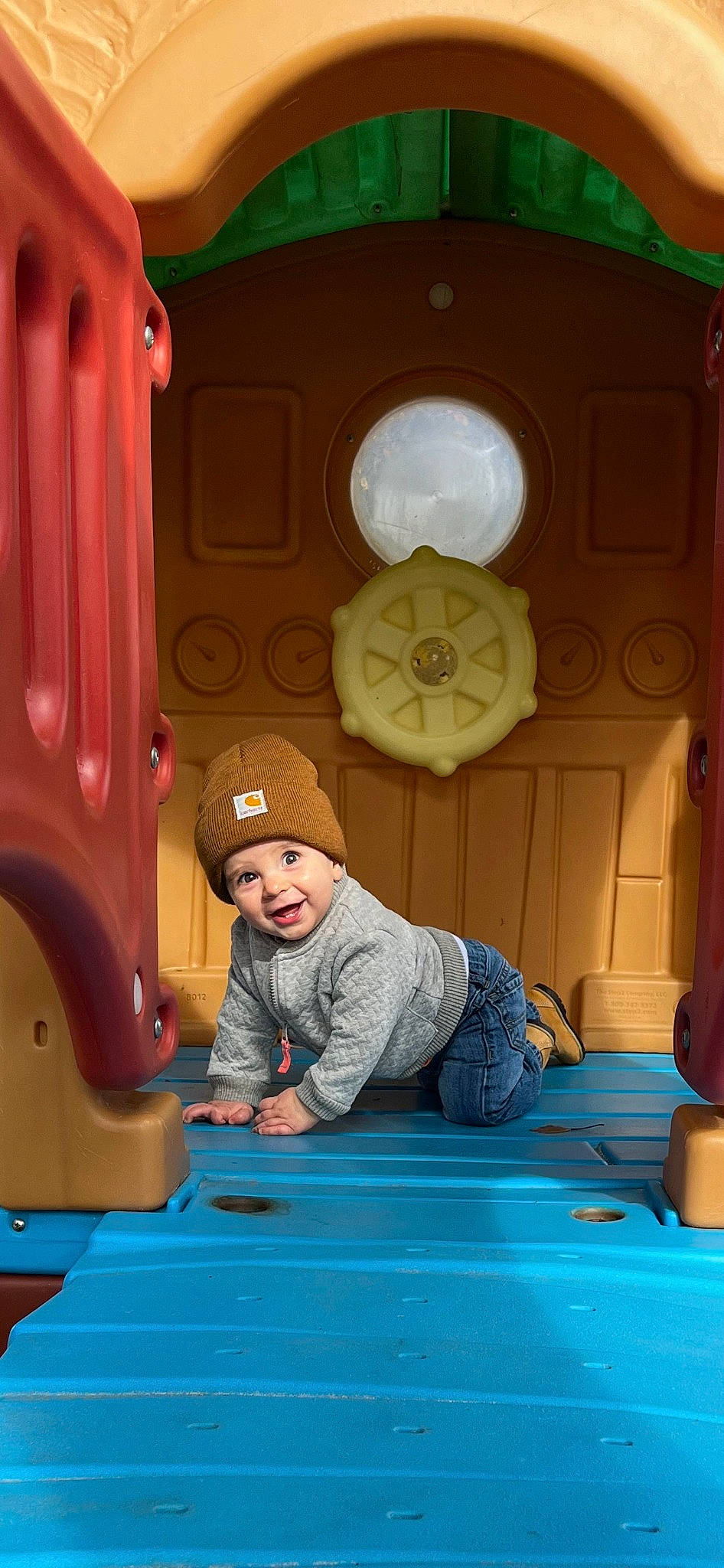 Alden joined the competition — help win amazing prizes! automotive_tire, baby, baby_toddler_clothing, blue, child, electric_blue, flooring, fun, green, headwear, human_settlement, leisure, motor_vehicle, person, photograph, playground, recreation, room, snapshot, tire