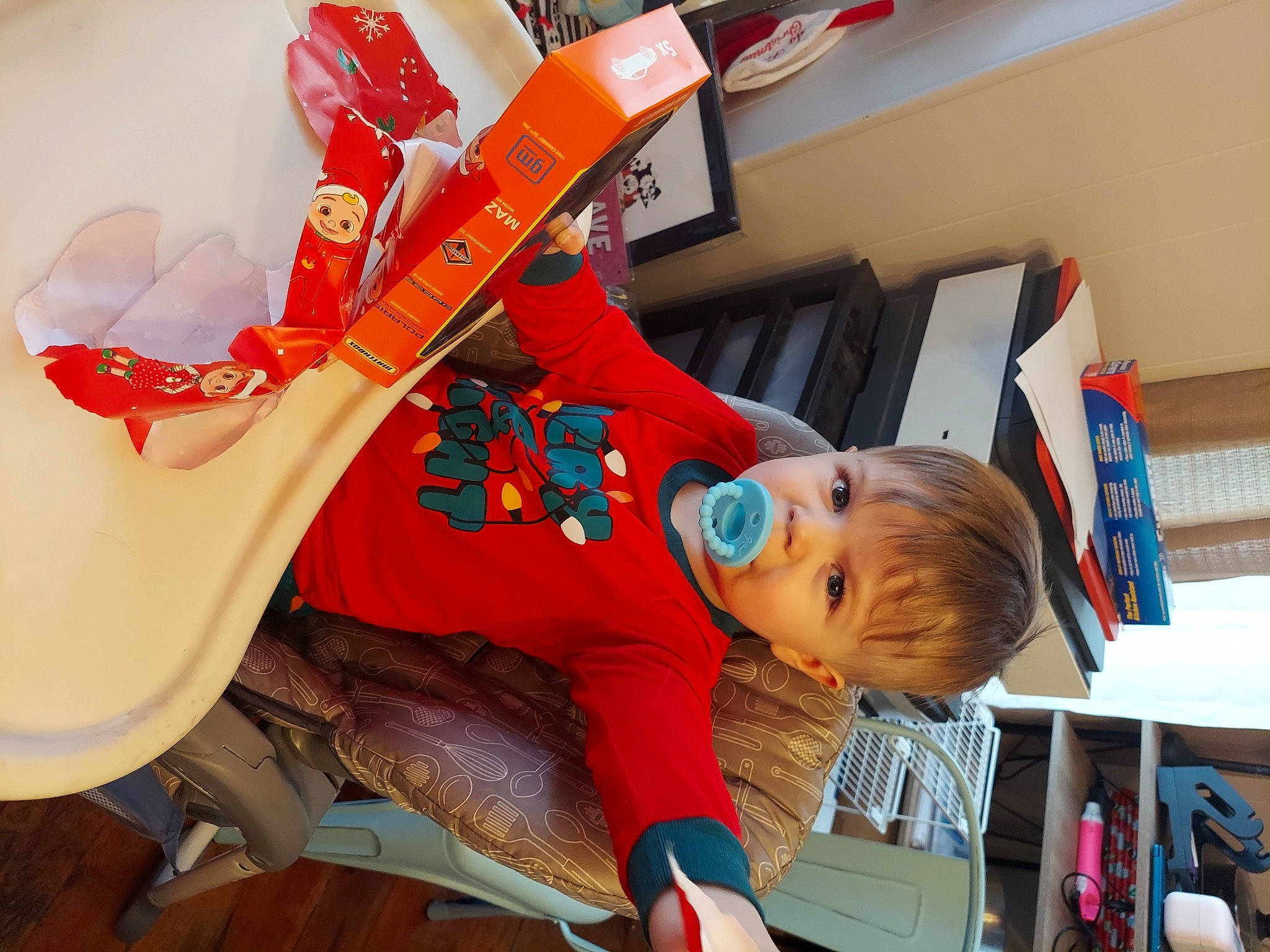 Gatlin is registered to the contest to win money with this photo: baby_products, carmine, chair, child, costume, fictional_character, fun, hat, leisure, musical_instrument, person, plastic, plucked_string_instruments, room, string_instrument, toddler, toy, wood