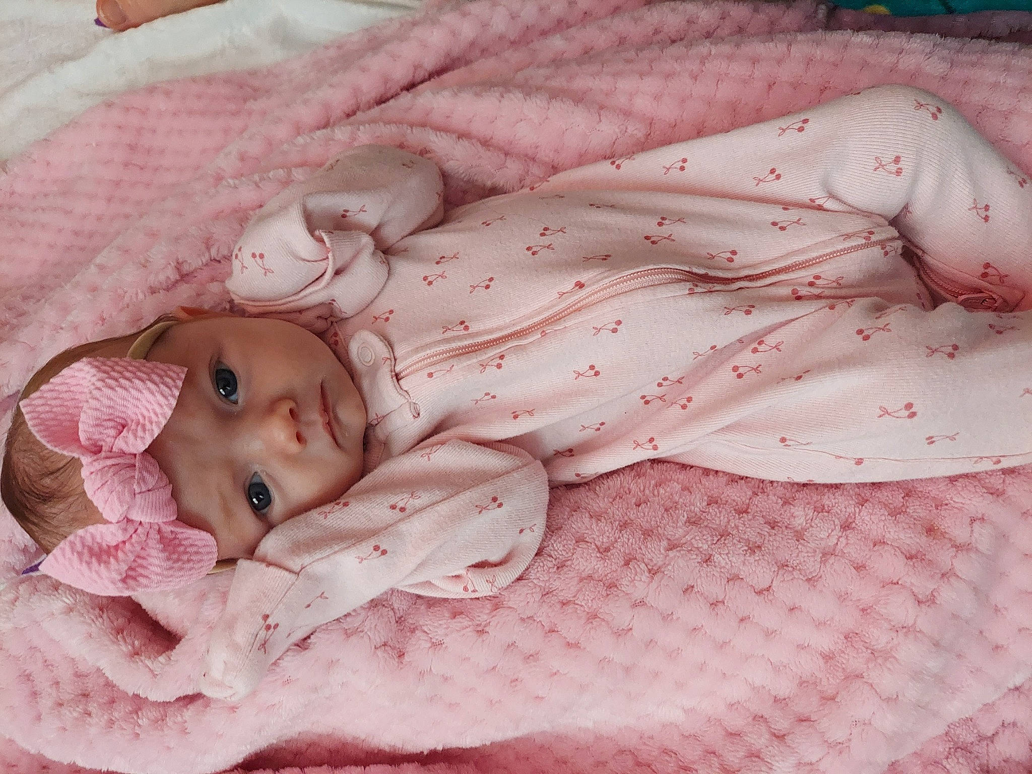 Leora joined the competition — help win amazing prizes! baby, baby_products, baby_toddler_clothing, bedding, bedtime, child, comfort, hand, headwear, linens, lip, magenta, pattern, peach, person, petal, pink, room, skin, sleep