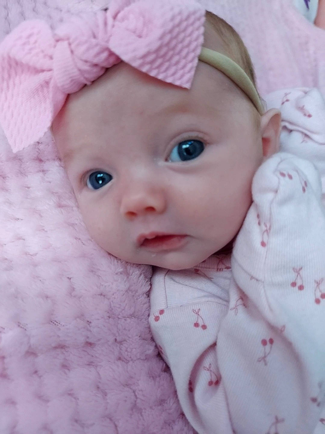 Leora joined the competition — help win amazing prizes! baby, baby_toddler_clothing, cap, cheek, child, chin, eye, hat, headgear, headwear, linens, lip, outerwear, pattern, person, pink, skin, sleeve, sun_hat, textile